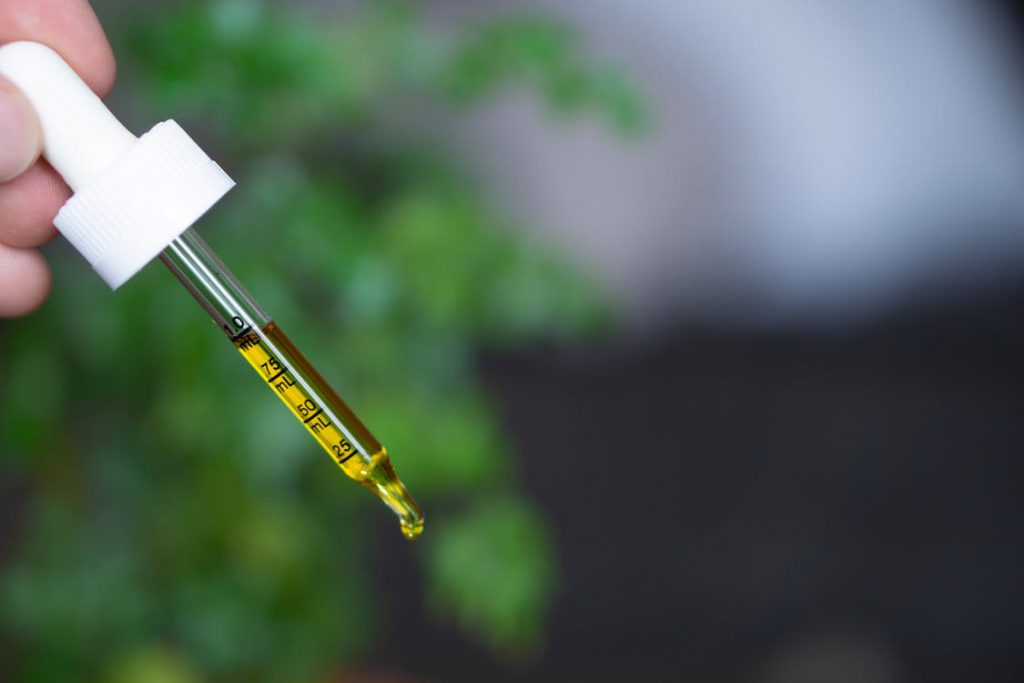 Glas dropper with Liquid CBD oil source pexels