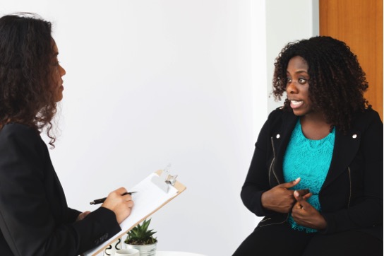 Woman speaks with doctor