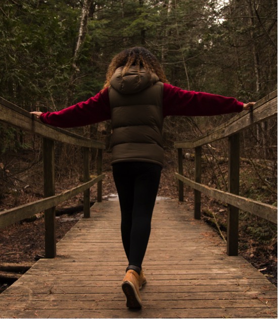 Walking over a wooden bridge