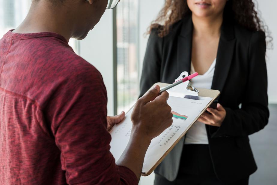 Reviewing notes on a clipboard